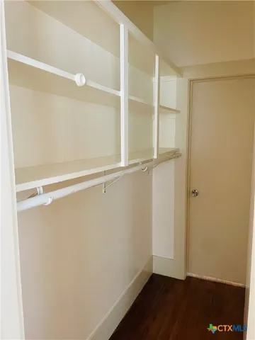 a view of an empty walk in closet
