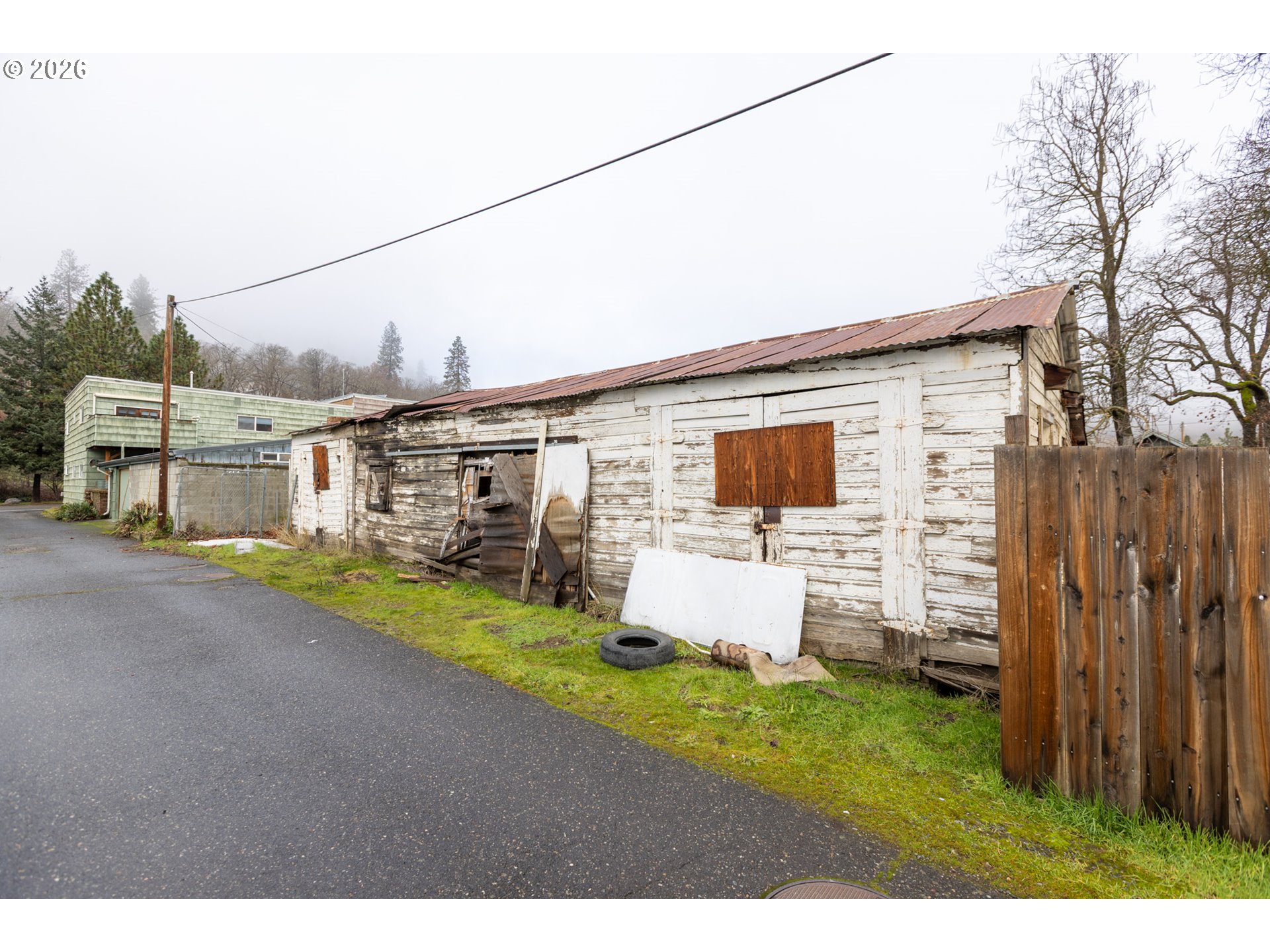 104 1st Street Klickitat, WA 98628 - Photo 34 of 48 a front view of a house with a yard and garage