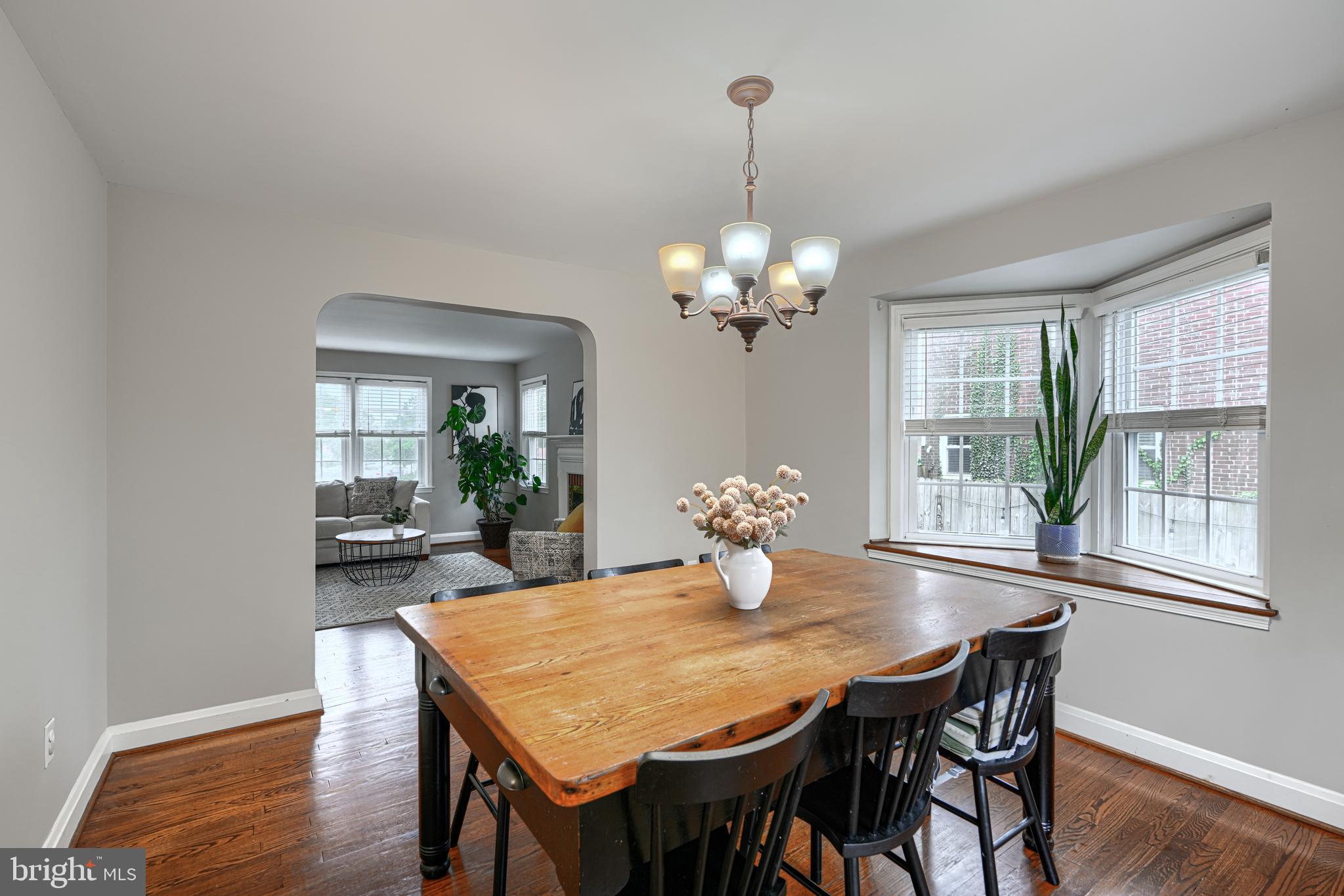 8132 Pleasant Plains Road Towson, MD 21286 - Photo 10 of 55 a view of a dining room with furniture wooden floor and chandelier