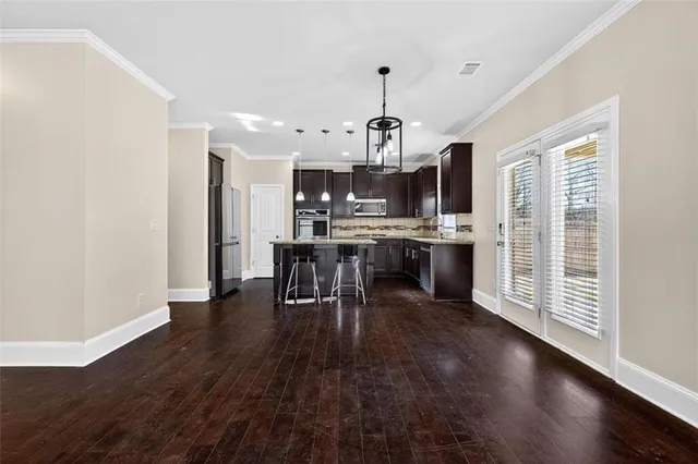 a view of a kitchen with microwave and stove