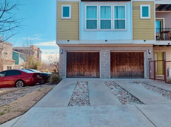 a front view of a house with parking