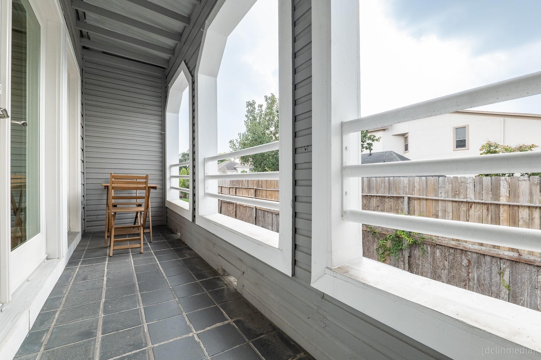 2002 Norfolk Street, Unit A Houston, TX 77098 - Photo 20 of 35 a view of a balcony with wooden floor