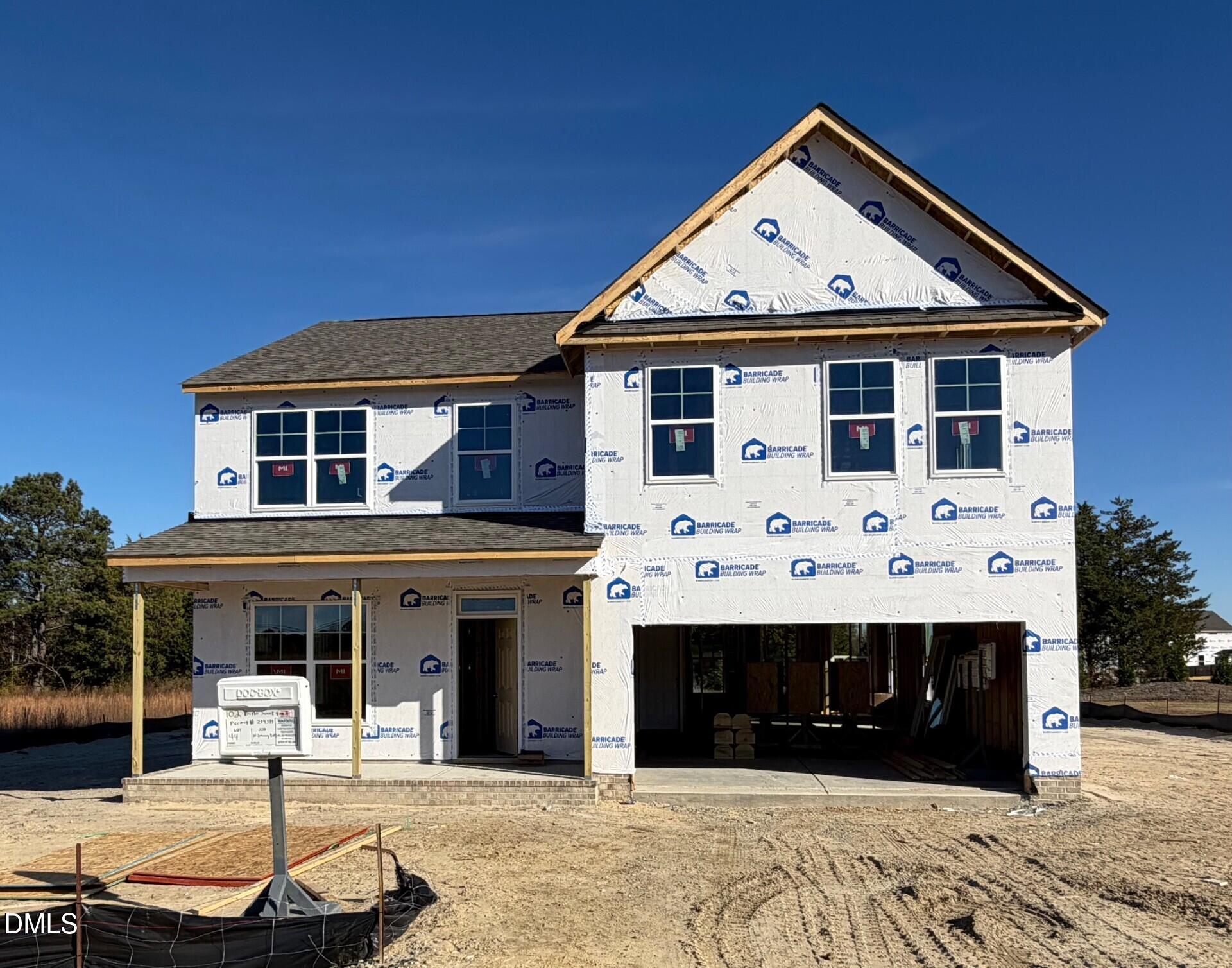 a front view of a house with yard
