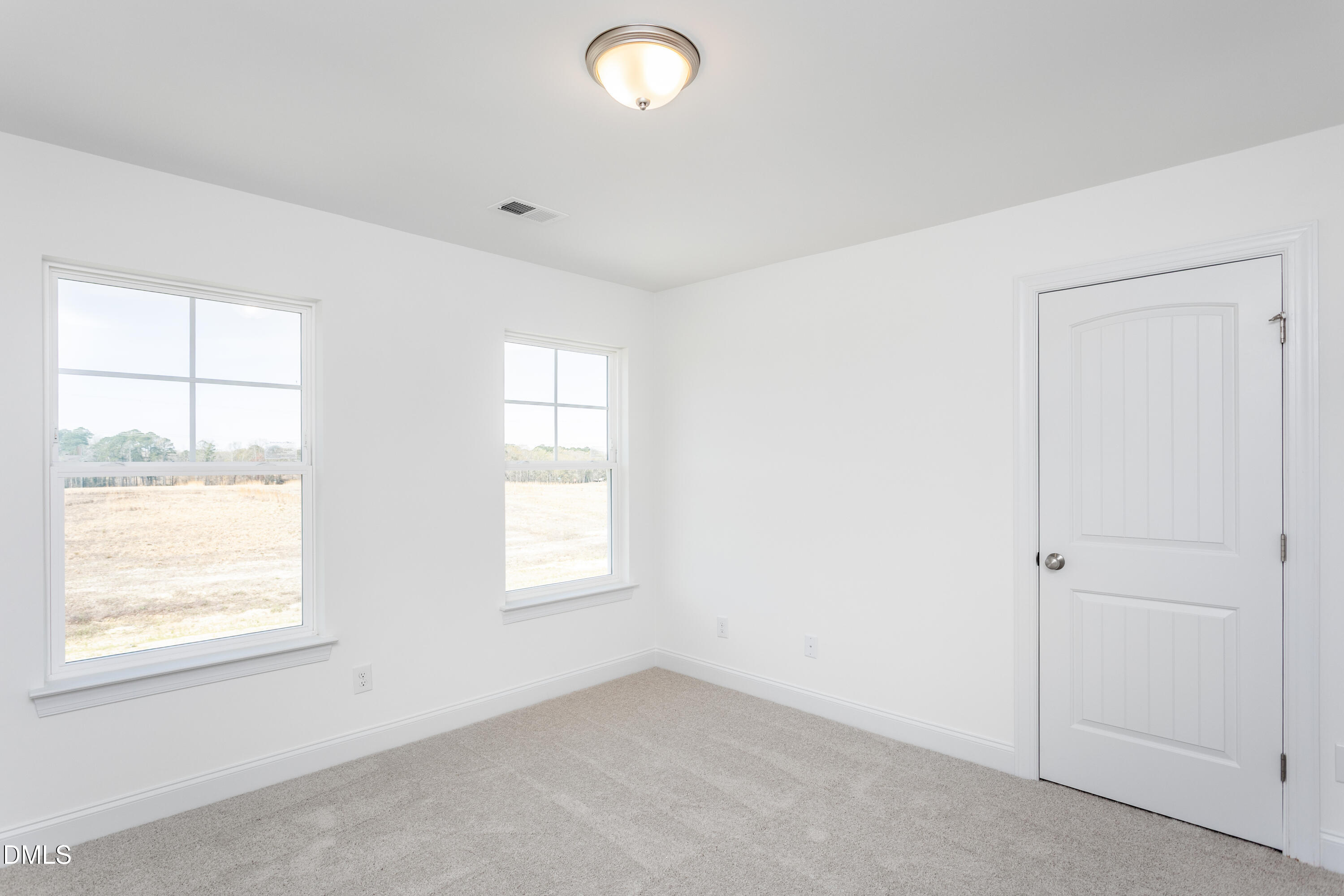 102 Bittersweet Trail Benson, NC 27504 - Photo 16 of 30 an empty room with windows