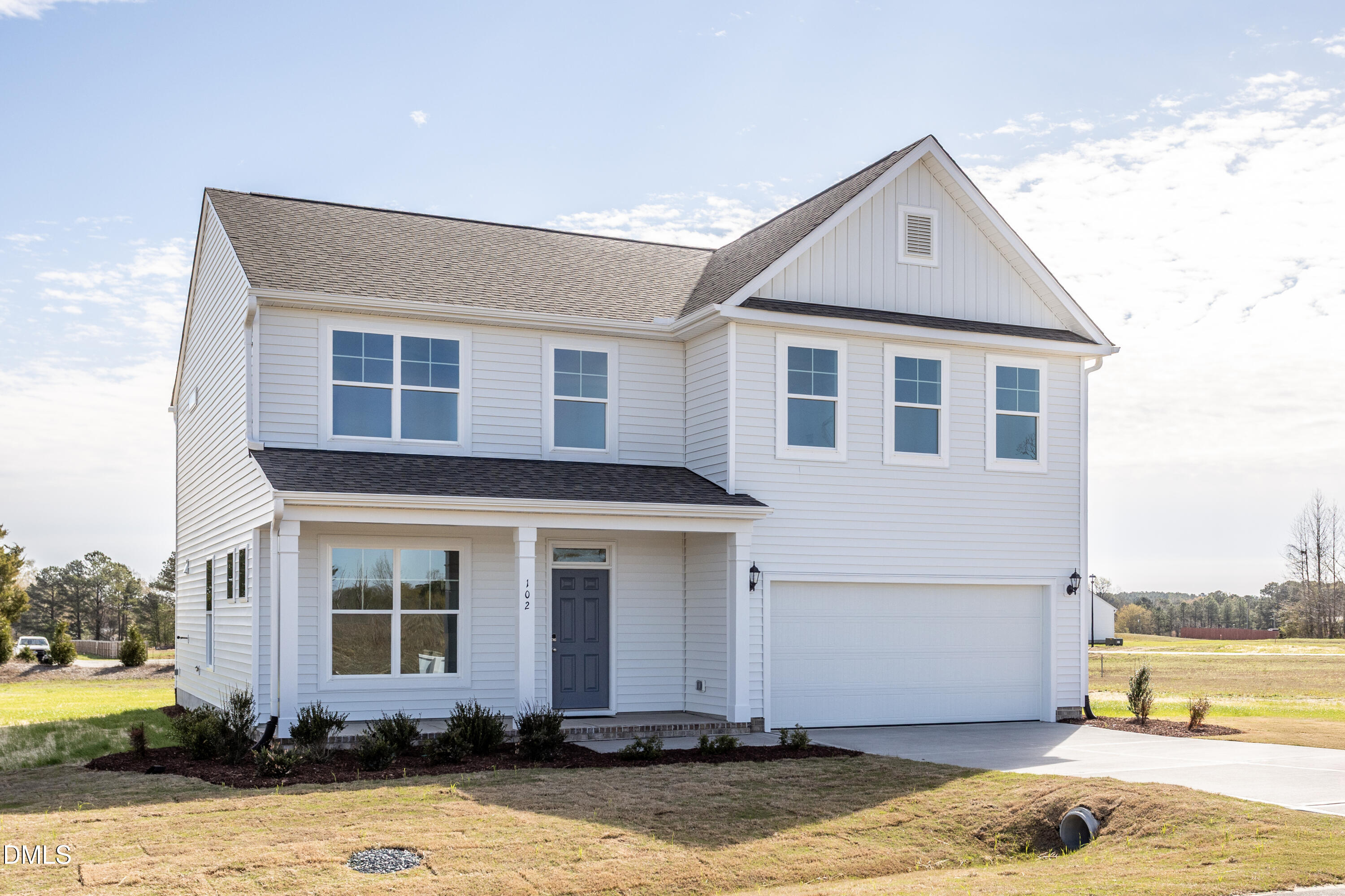102 Bittersweet Trail Benson, NC 27504 - Photo 2 of 30 a front view of a house with a yard