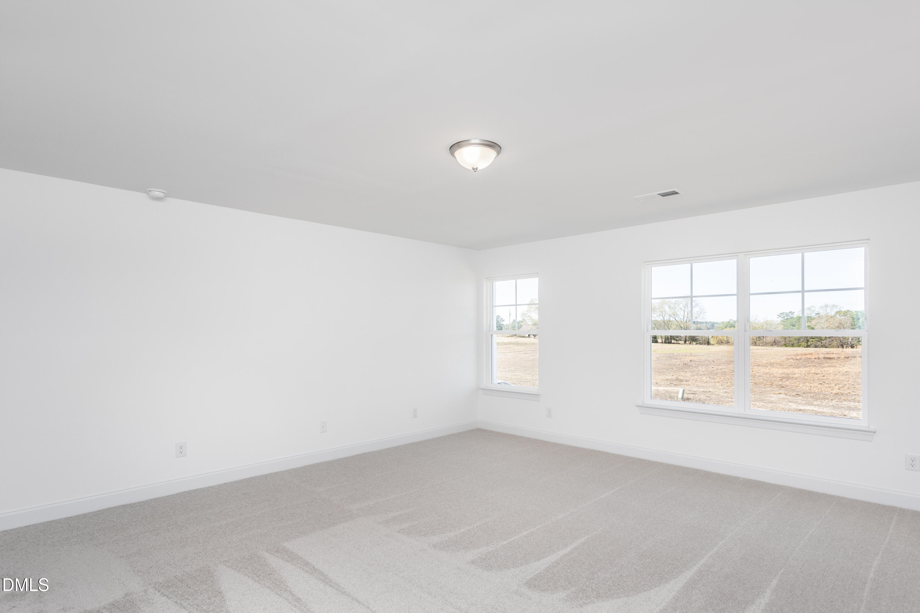 102 Bittersweet Trail Benson, NC 27504 - Photo 21 of 30 an empty room with windows