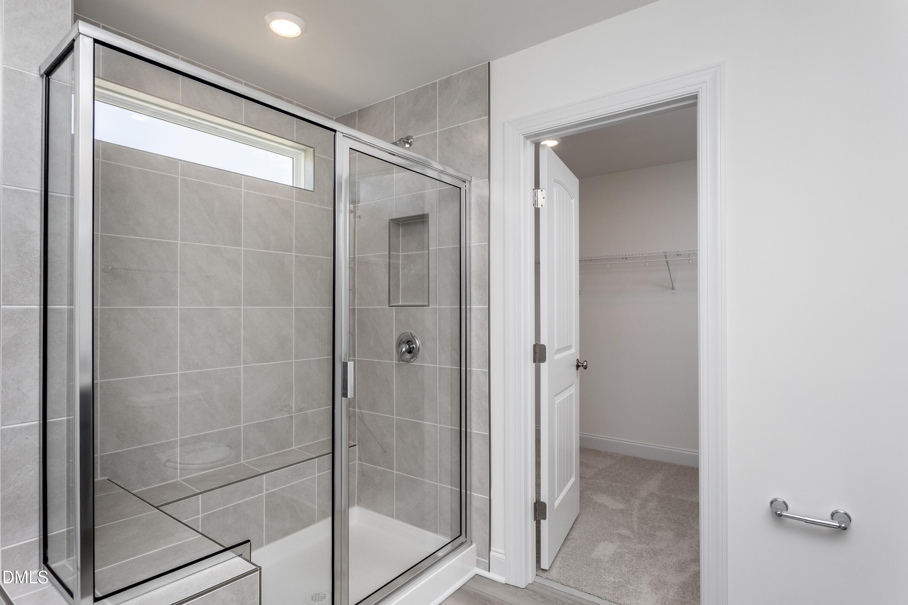 102 Bittersweet Trail Benson, NC 27504 - Photo 30 of 30 a bathroom with a glass shower door