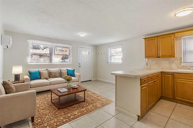 a living room with granite countertop furniture and a window