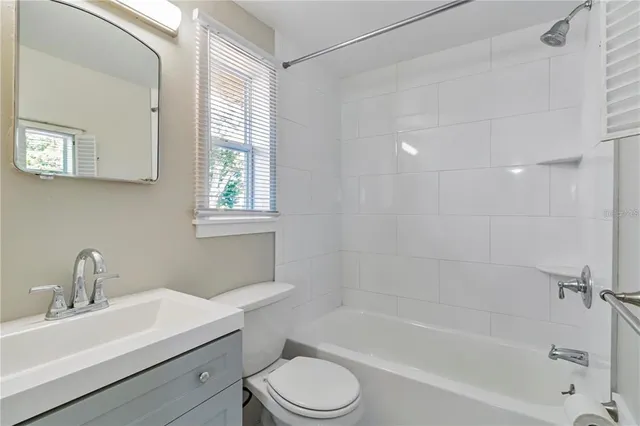 a bathroom with a sink toilet and bathtub