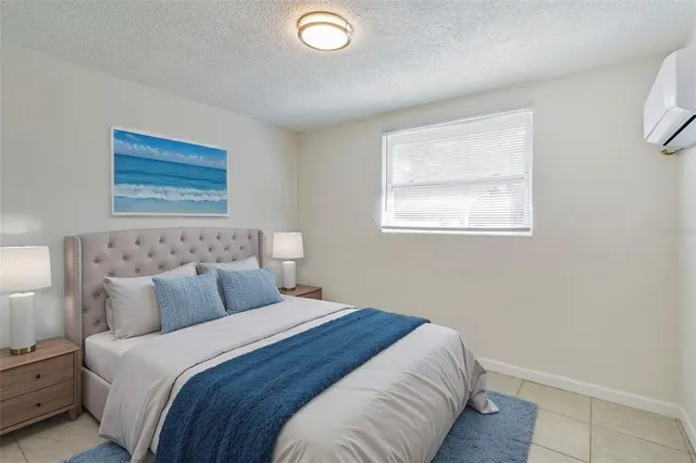 a bedroom with bed and window