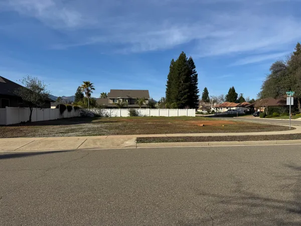 a view of a house and a yard