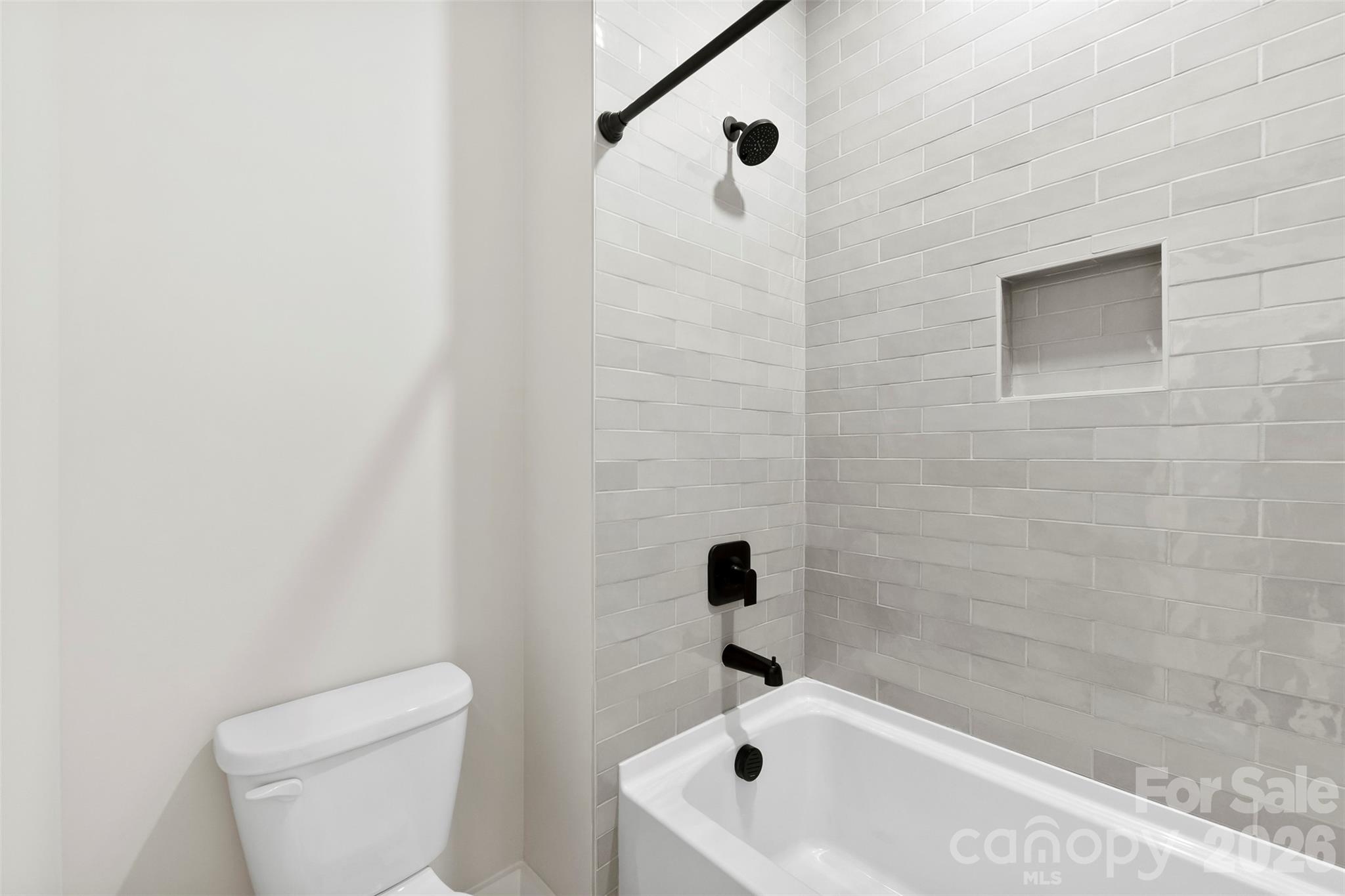 551 Perry Road Troutman, NC 28166 - Photo 37 of 47 a bathroom with a sink a toilet and shower