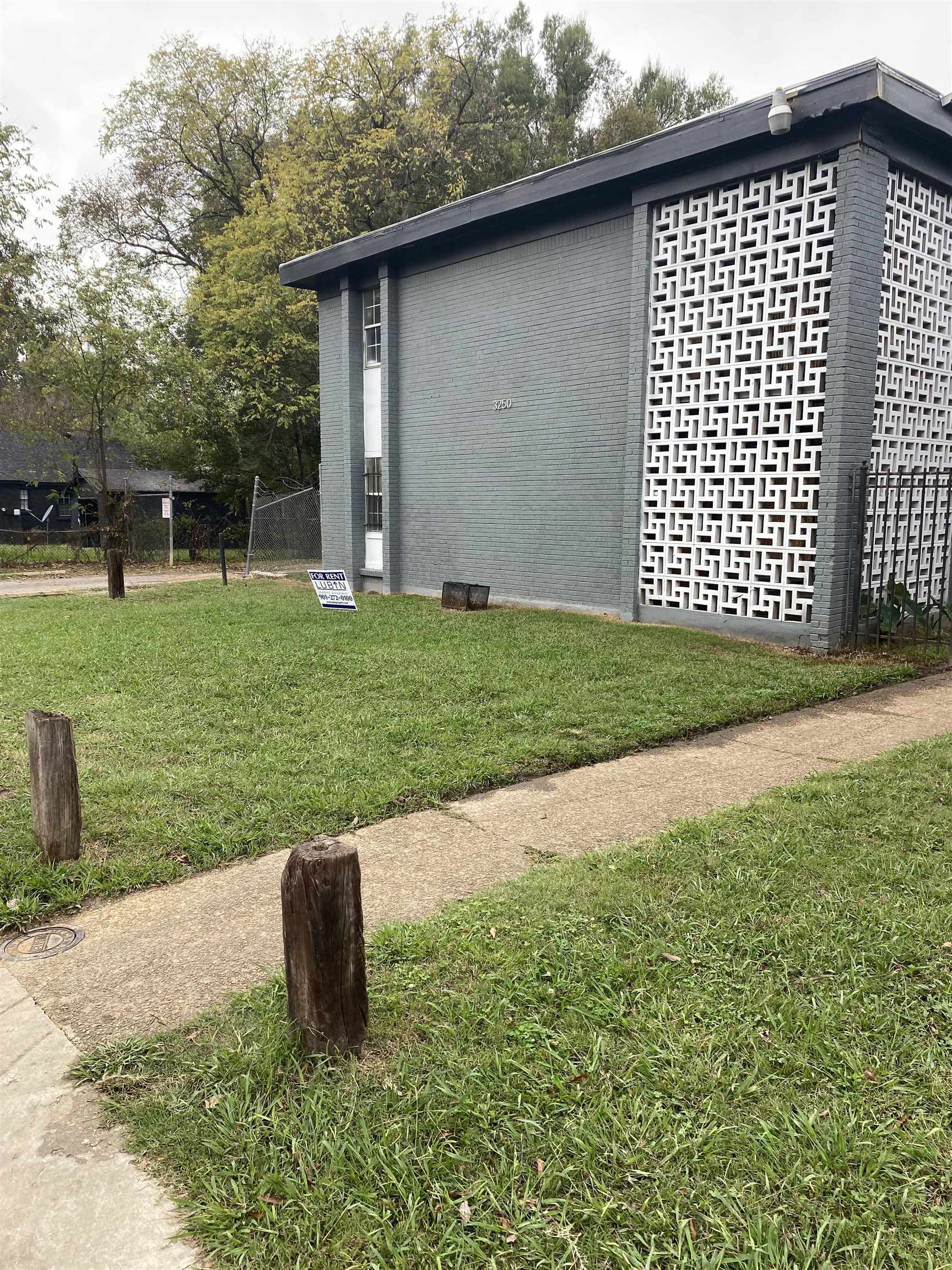 3250 Guernsey Avenue Memphis, TN 38112 - Photo 1 of 1 a backyard of a house with lots of green space