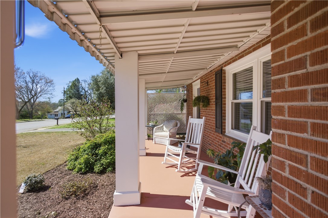 310 Retreat Street Westminster, SC 29693 - Photo 6 of 46 Relax on the inviting porch of this charming brick home.