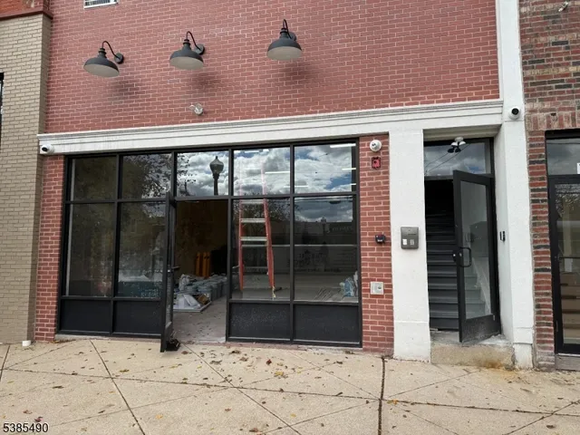 a kitchen with stainless steel appliances granite countertop a refrigerator stove a sink and dishwasher