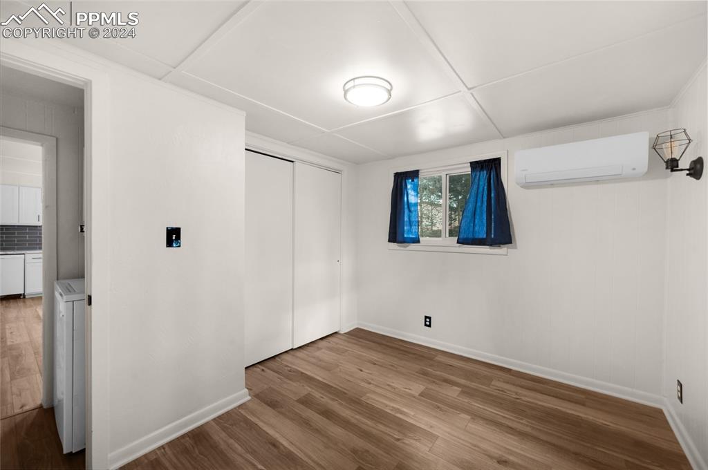 53 Iris Road Woodland Park, CO 80863 - Photo 13 of 27 a view of a livingroom with wooden floor and window