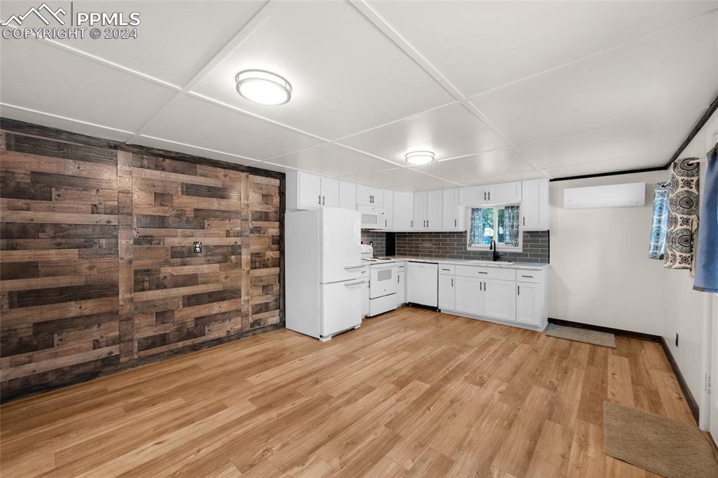 53 Iris Road Woodland Park, CO 80863 - Photo 7 of 27 a view of kitchen and wooden floor