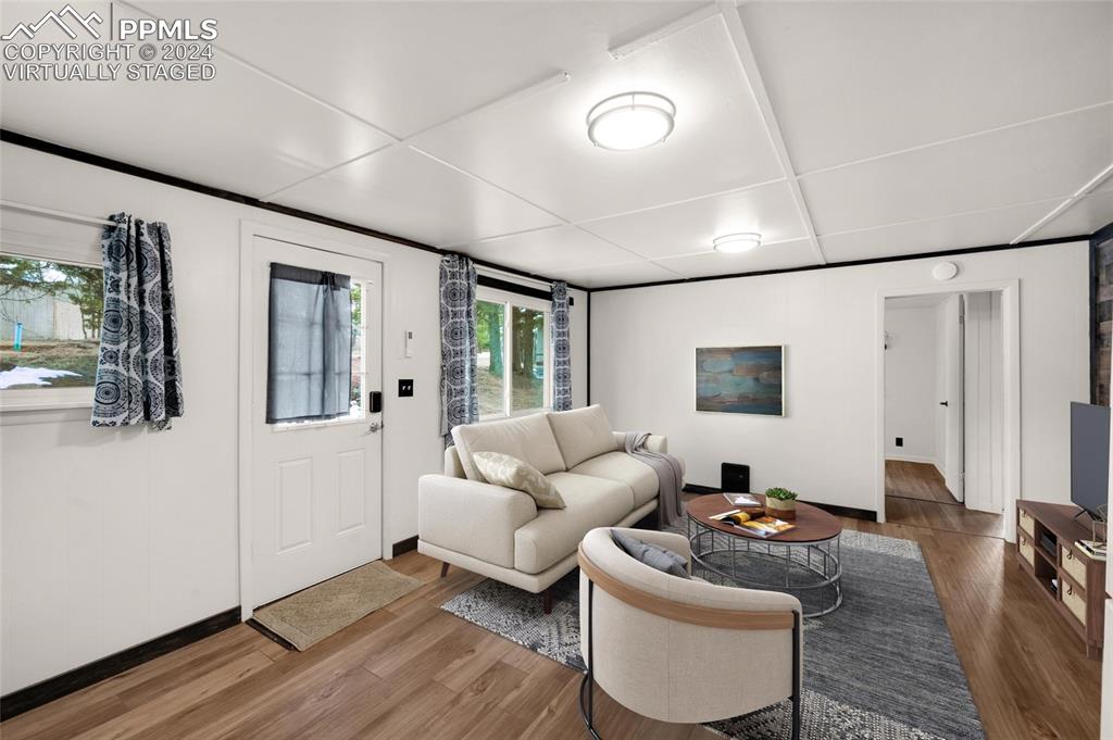 53 Iris Road Woodland Park, CO 80863 - Photo 8 of 27 a living room with furniture and a flat screen tv