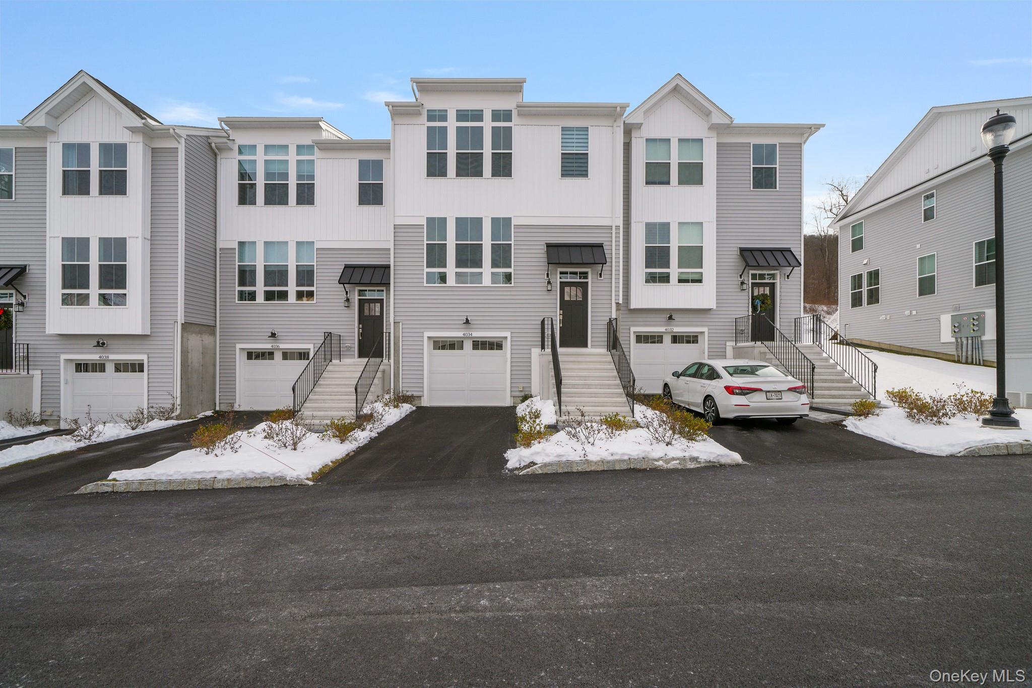 4034 Chestnut Rdg Road, Unit 62 Fishkill, NY 12524 - Photo 1 of 31 View of front of home with driveway and board and batten siding