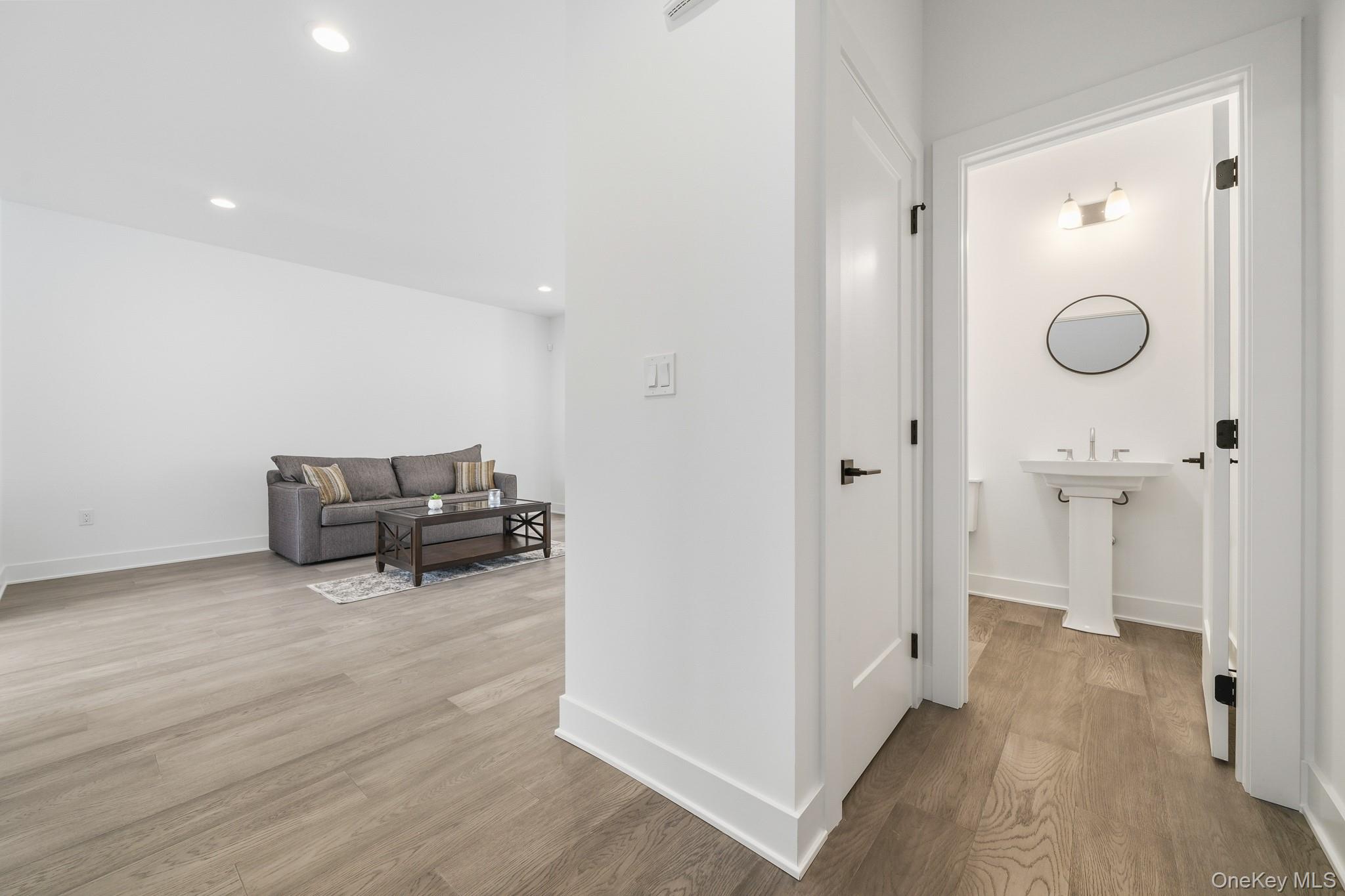 4034 Chestnut Rdg Road, Unit 62 Fishkill, NY 12524 - Photo 14 of 31 Hallway featuring half bath, light wood-style floors and recessed lighting