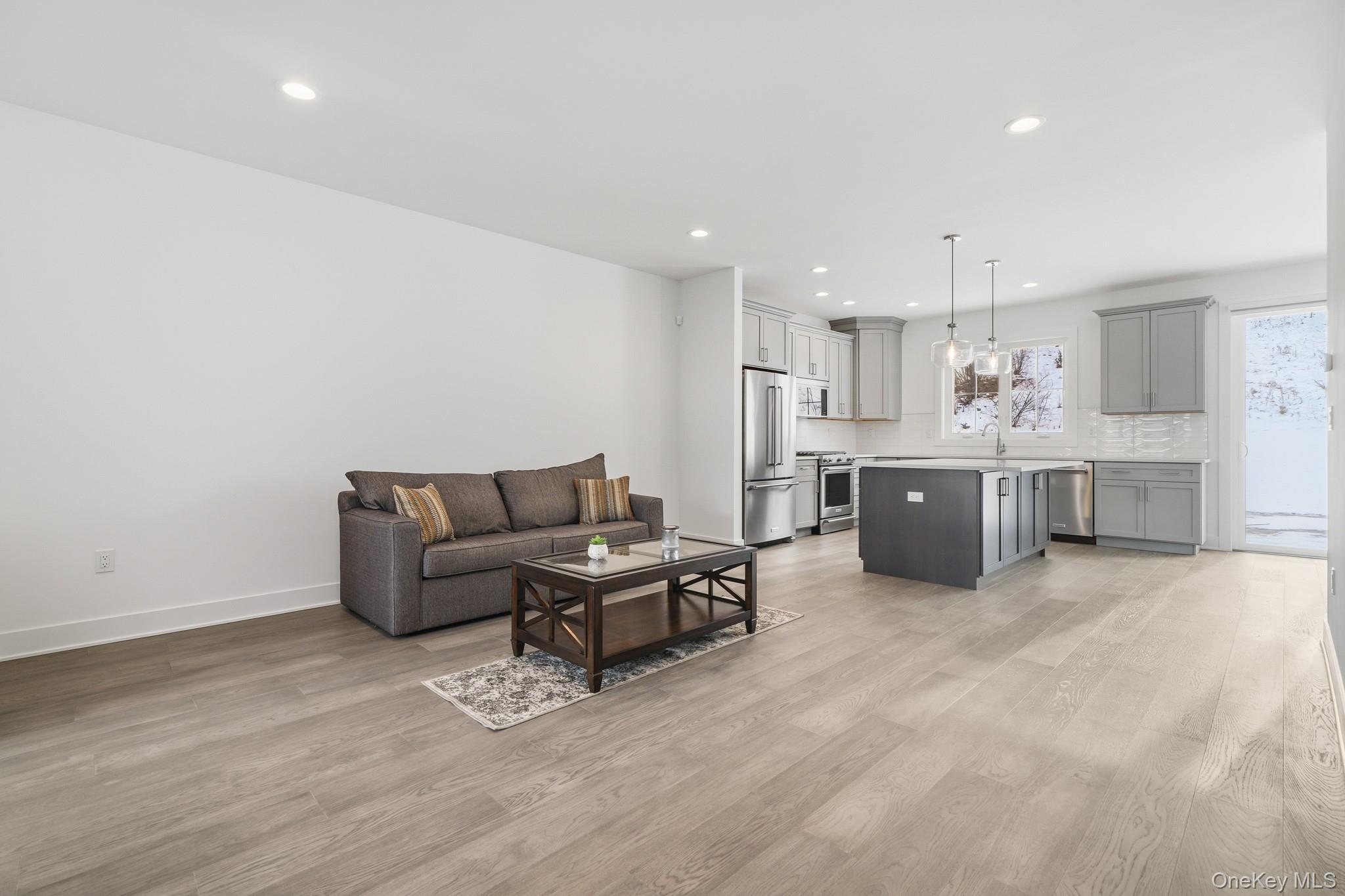 4034 Chestnut Rdg Road, Unit 62 Fishkill, NY 12524 - Photo 15 of 31 Living room with light wood-style floors and recessed lighting