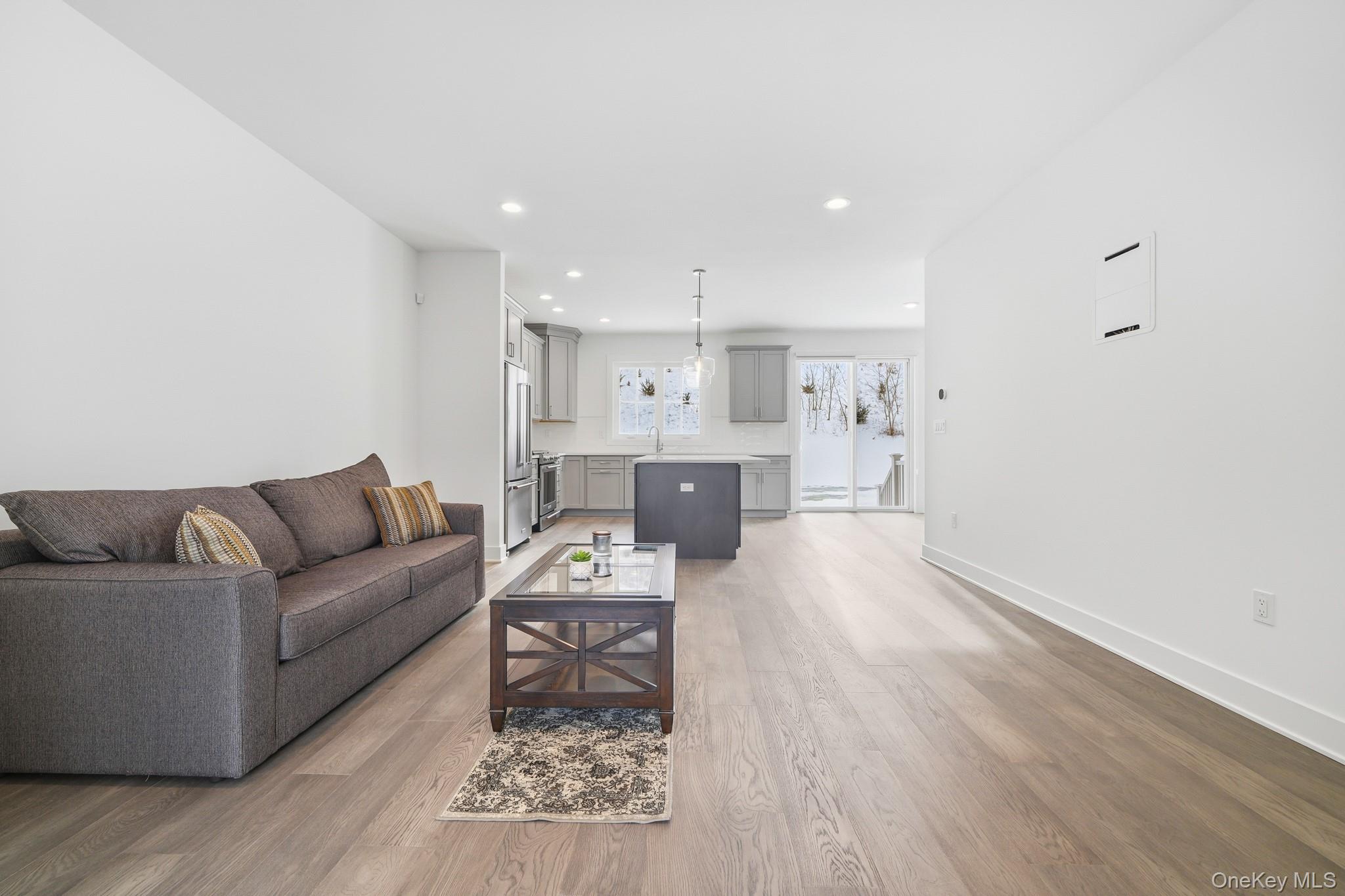 4034 Chestnut Rdg Road, Unit 62 Fishkill, NY 12524 - Photo 17 of 31 Living area with light wood finished floors and recessed lighting