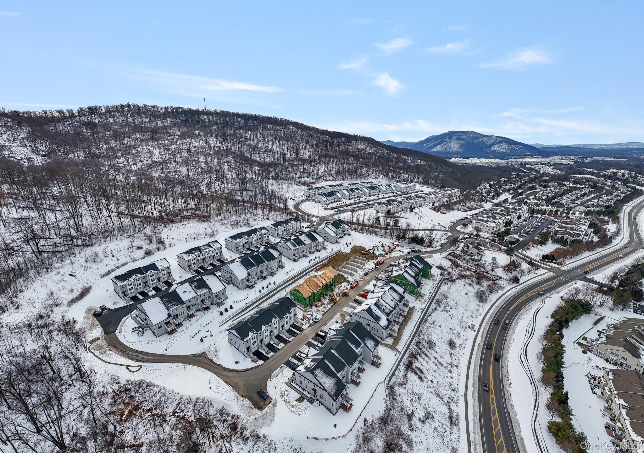 4034 Chestnut Rdg Road, Unit 62 Fishkill, NY 12524 - Photo 7 of 31 Snowy aerial view with a mountain view