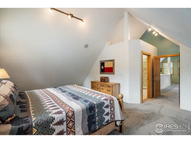 a bedroom with a bed and a cabinets