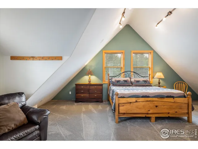 a bedroom with bed and window