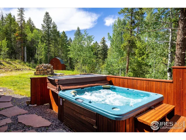 a view of a house with a sink and wooden fence