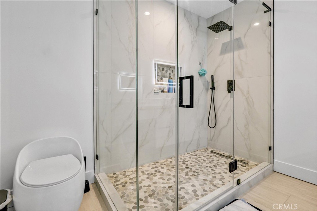 6900 Corbin Avenue Reseda, CA 91335 - Photo 12 of 50 a bathroom with a granite countertop shower and toilet