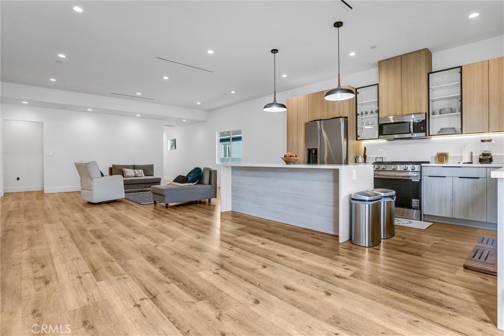 6900 Corbin Avenue Reseda, CA 91335 - Photo 20 of 50 a large kitchen with cabinets and a wooden floor