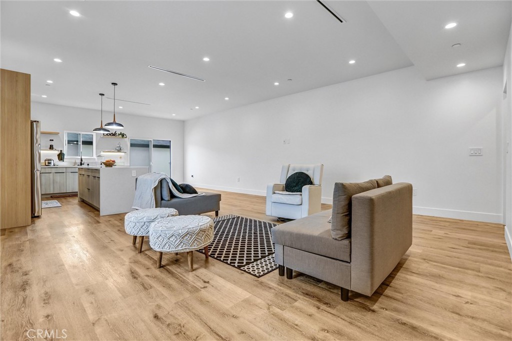 6900 Corbin Avenue Reseda, CA 91335 - Photo 22 of 50 a living room with furniture and a wooden floor
