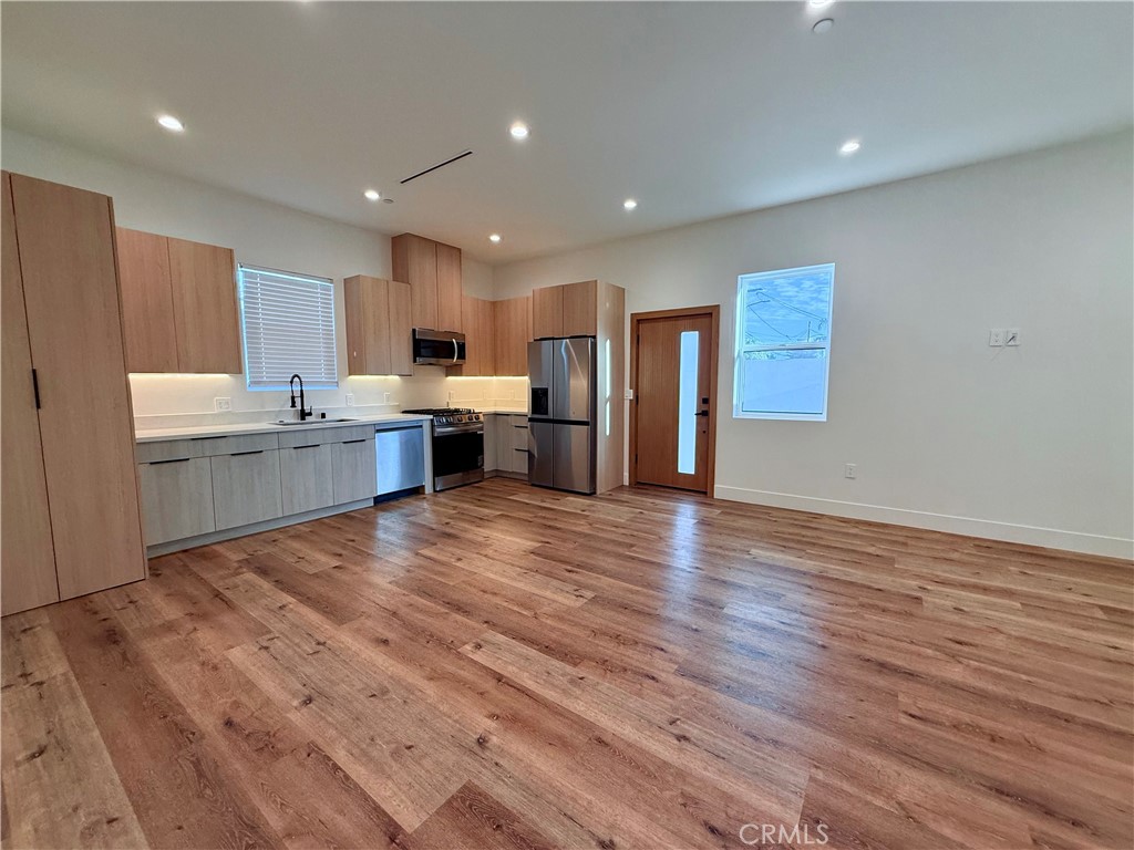 6900 Corbin Avenue Reseda, CA 91335 - Photo 27 of 50 a view of kitchen and kitchen with wooden floor