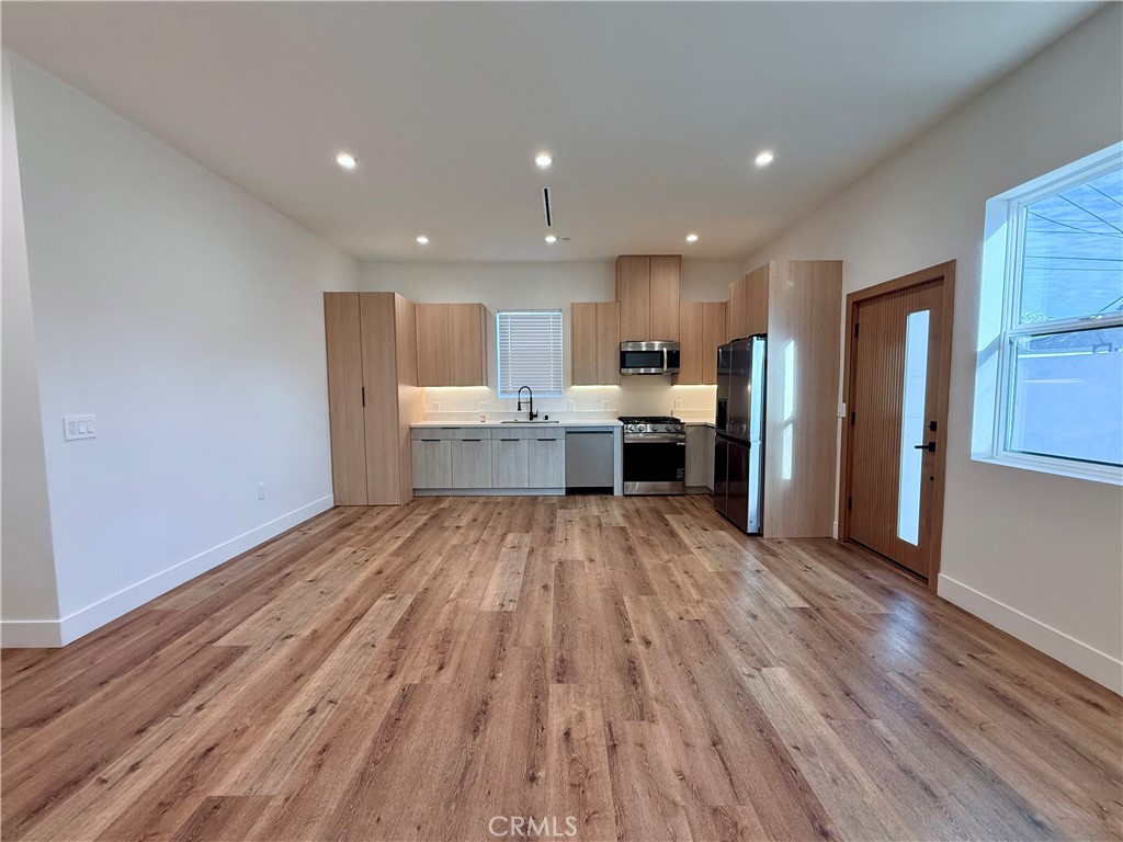 6900 Corbin Avenue Reseda, CA 91335 - Photo 32 of 50 a view of kitchen view wooden floors appliances and cabinets