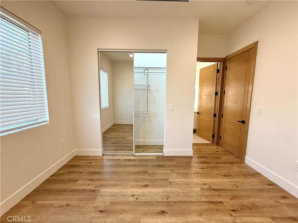 6900 Corbin Avenue Reseda, CA 91335 - Photo 40 of 50 a view of wooden floor and brick walls