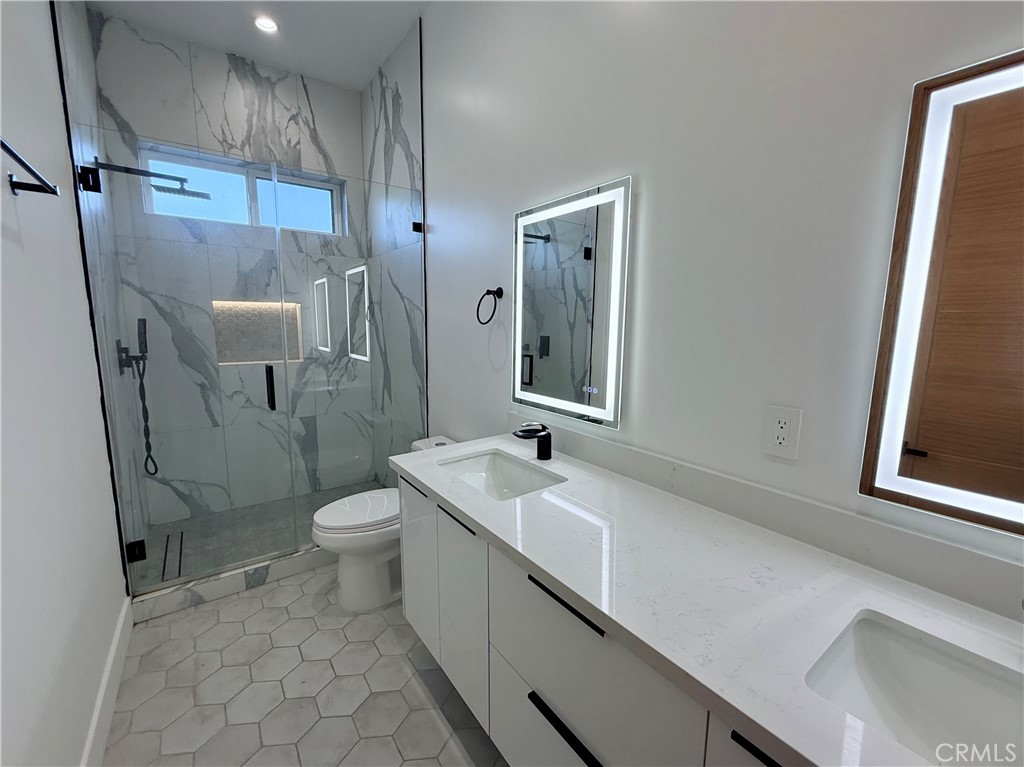 6900 Corbin Avenue Reseda, CA 91335 - Photo 42 of 50 a bathroom with a sink a toilet and shower