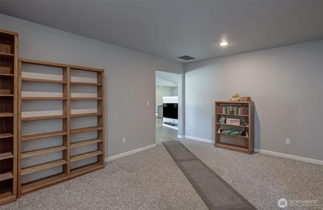 a view of a hallway with bathroom