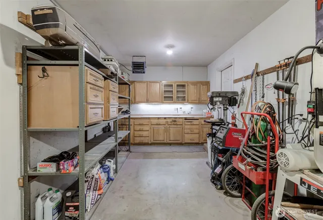 a aerial view of a house with a yard and potted plants