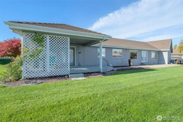 an aerial view of residential houses with outdoor space and street view