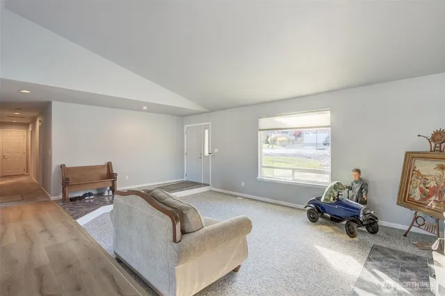 a dining room with furniture and wooden floor