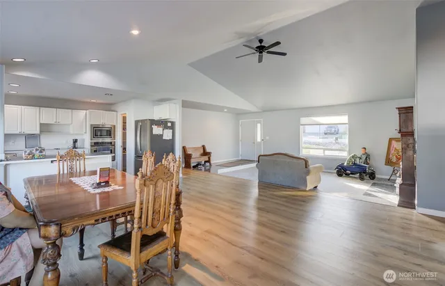 a living room with furniture and kitchen view