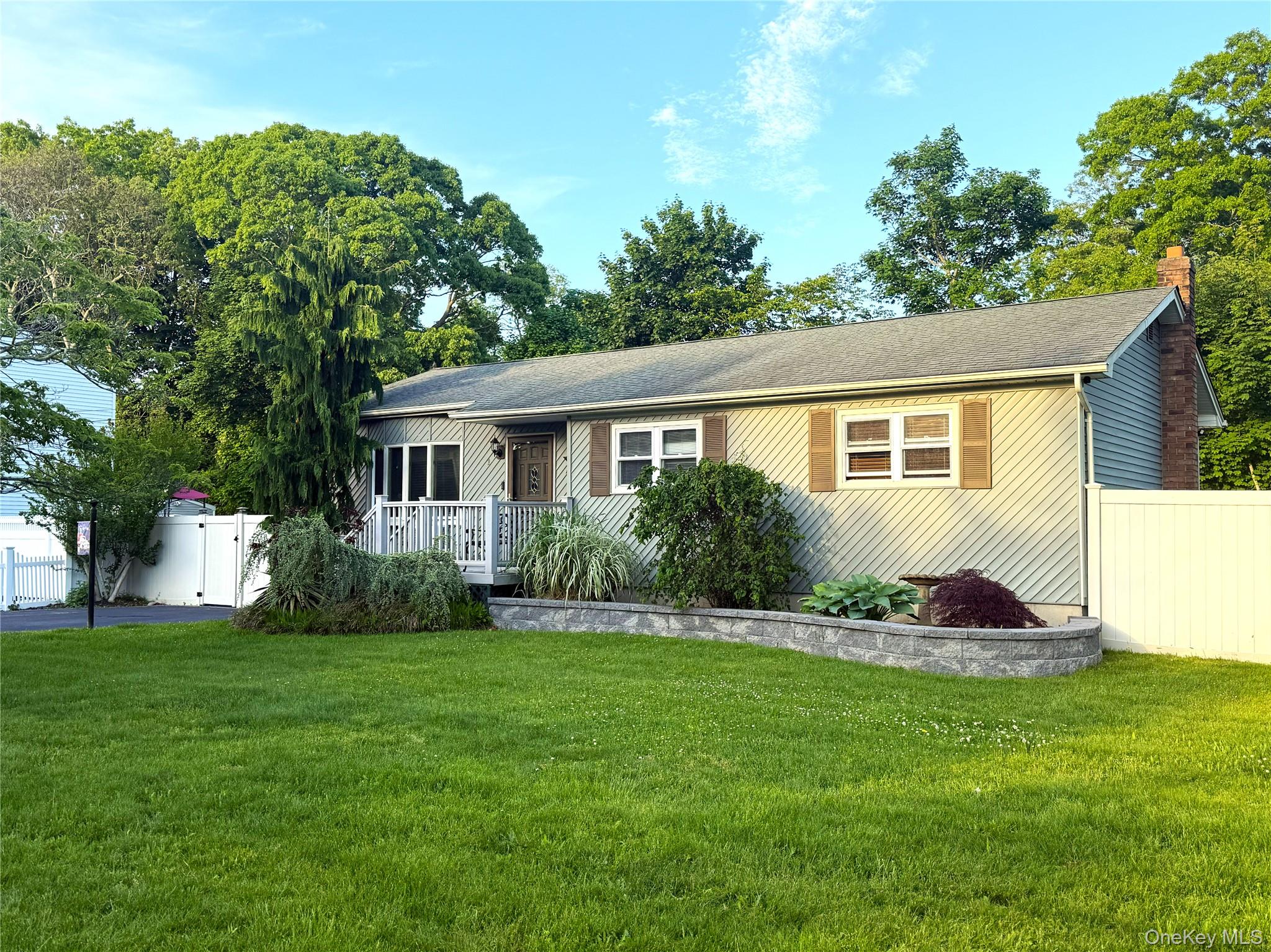 1 Heston Road Shirley, NY 11967 - Photo 2 of 32 Ranch-style residence featuring horizontal siding, a gabled roof, and a brick chimney
