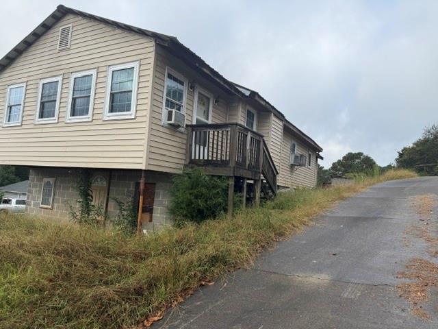 227 McConnell Road Calhoun, GA 30701 - Photo 3 of 16 a backyard of a house with plants and lake view