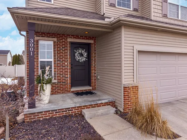 a front view of a house with a garage