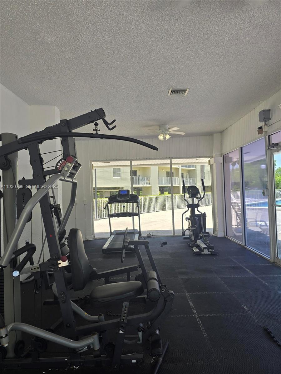 8200 Southwest 210th Street, Unit 103 Cutler Bay, FL 33189 - Photo 13 of 19 a room with gym equipment