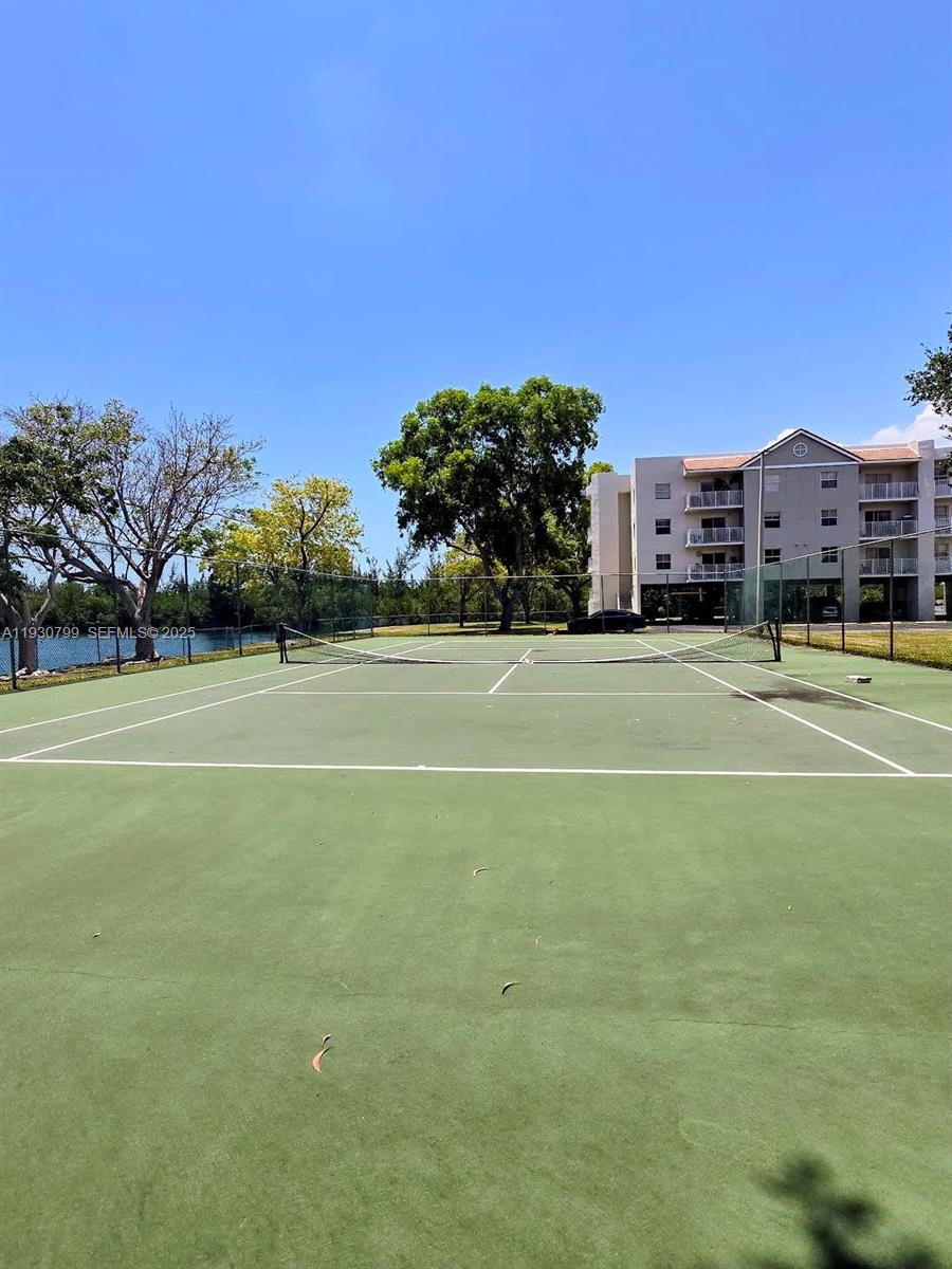 8200 Southwest 210th Street, Unit 103 Cutler Bay, FL 33189 - Photo 16 of 19 a view of a tennis court