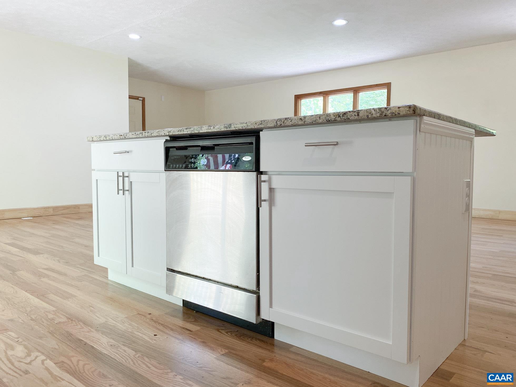 247 Goldenrod Road Ruckersville, VA 22968 - Photo 12 of 35 a view of kitchen with refrigerator and wooden floor