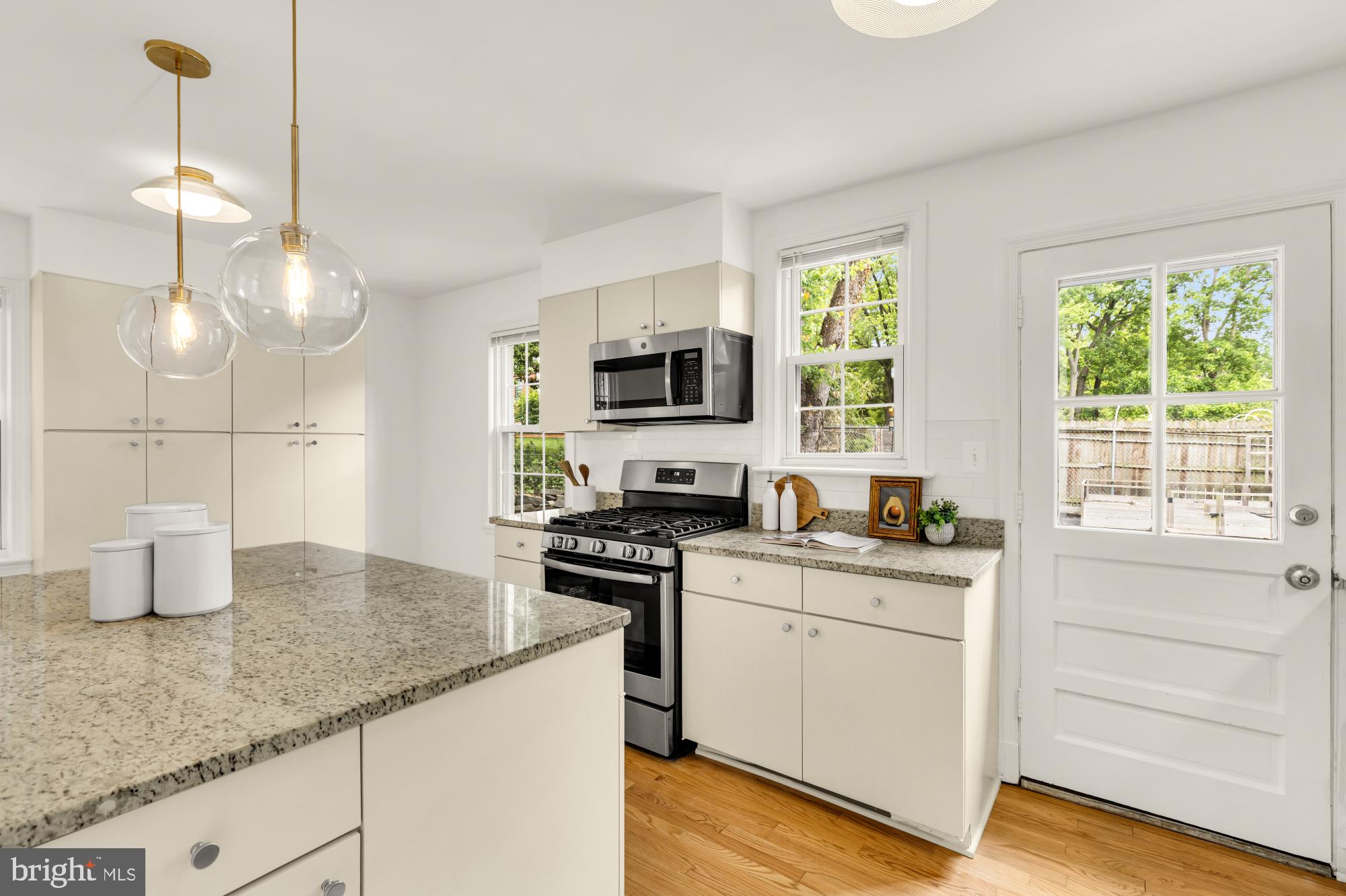 2030 Luzerne Avenue Silver Spring, MD 20910 - Photo 5 of 25 a kitchen with granite countertop a sink a counter space appliances and cabinets