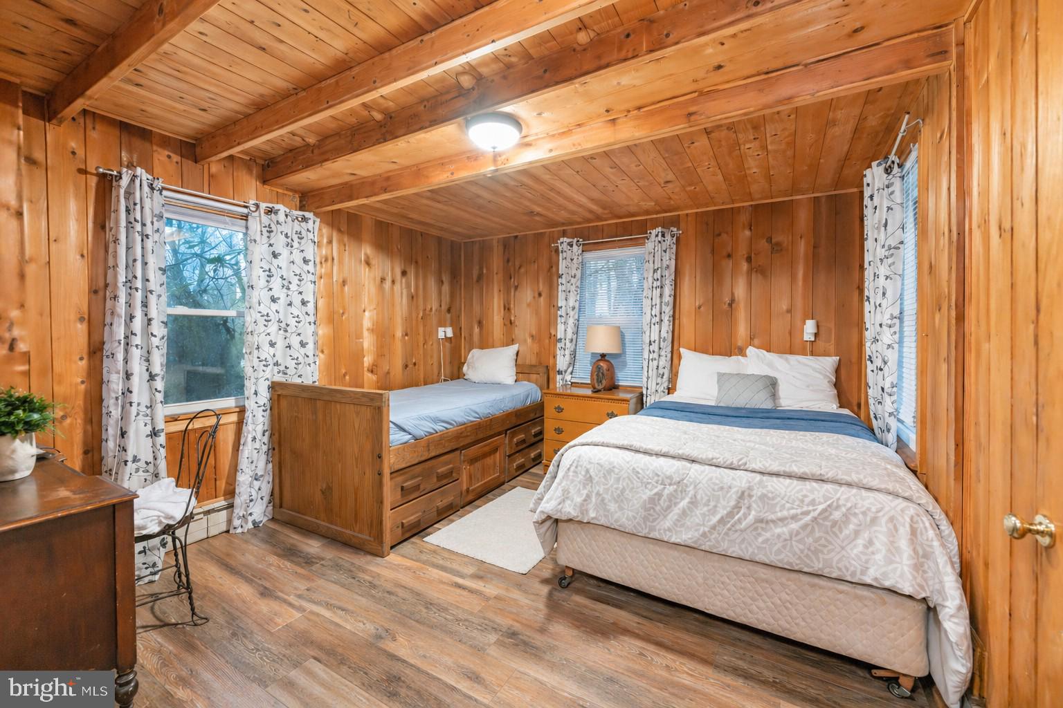 2187 State Park Road Swanton, MD 21561 - Photo 15 of 29 a spacious bedroom with a bed and glass door